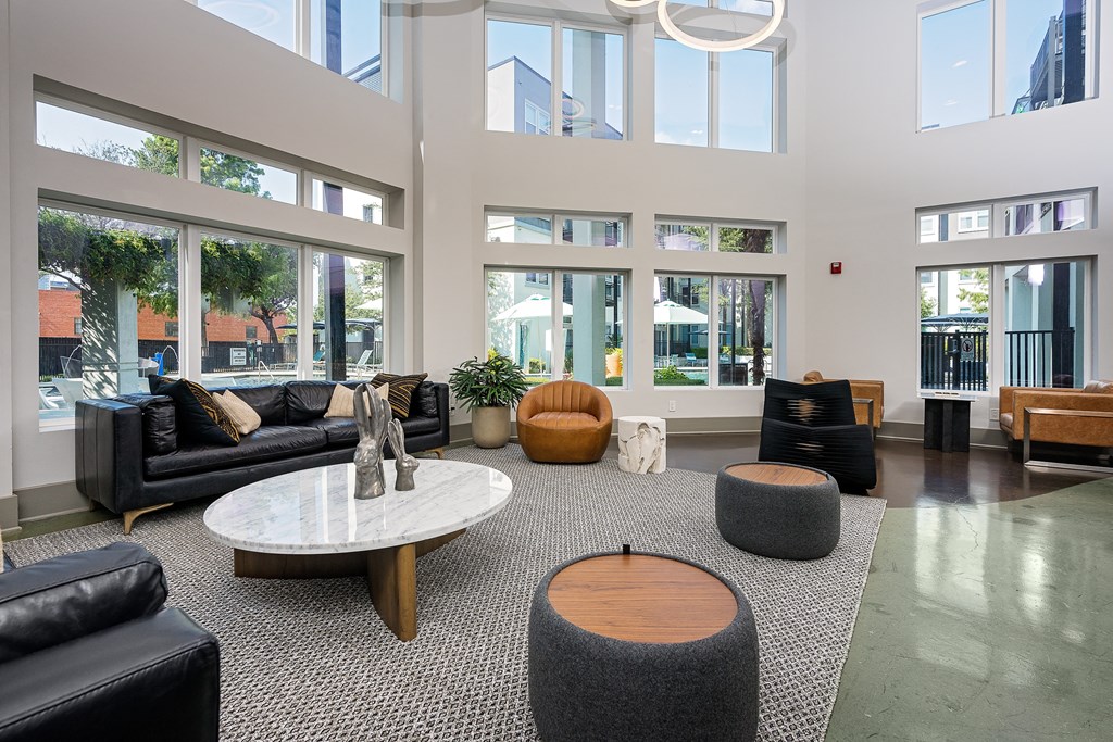 Lobby with seating and tables and lots of windows at Trend Design District, Texas