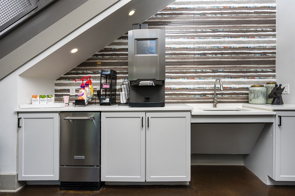 Sink and coffee station in lobby at Trend Design District, Dallas, TX