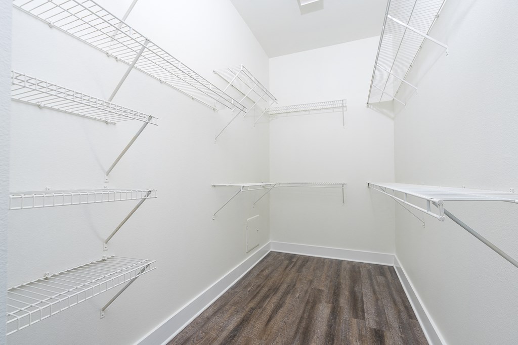 Large walk in closet with shelves at Trend Design District, Dallas, Texas
