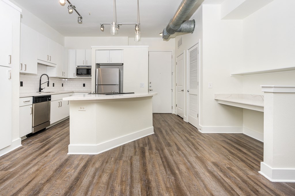 a kitchen and dining area in a 555 waverly unit at Trend Design District, Dallas, 75207