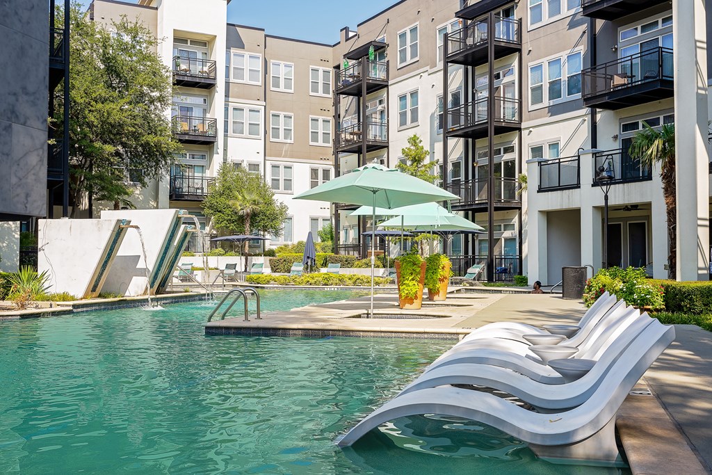 take a dip in the resort style pool at the bradley braddock road station apartments at Trend Design District, Dallas, TX