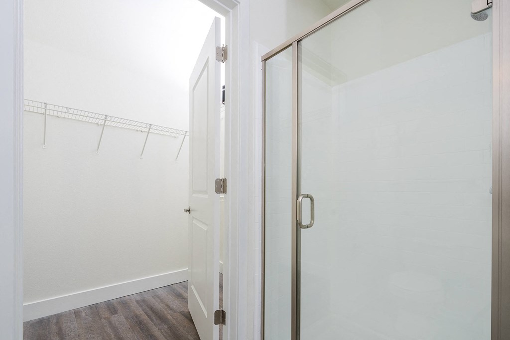 walk in shower with view from walk in closet at Trend Design District, Dallas, TX 75207