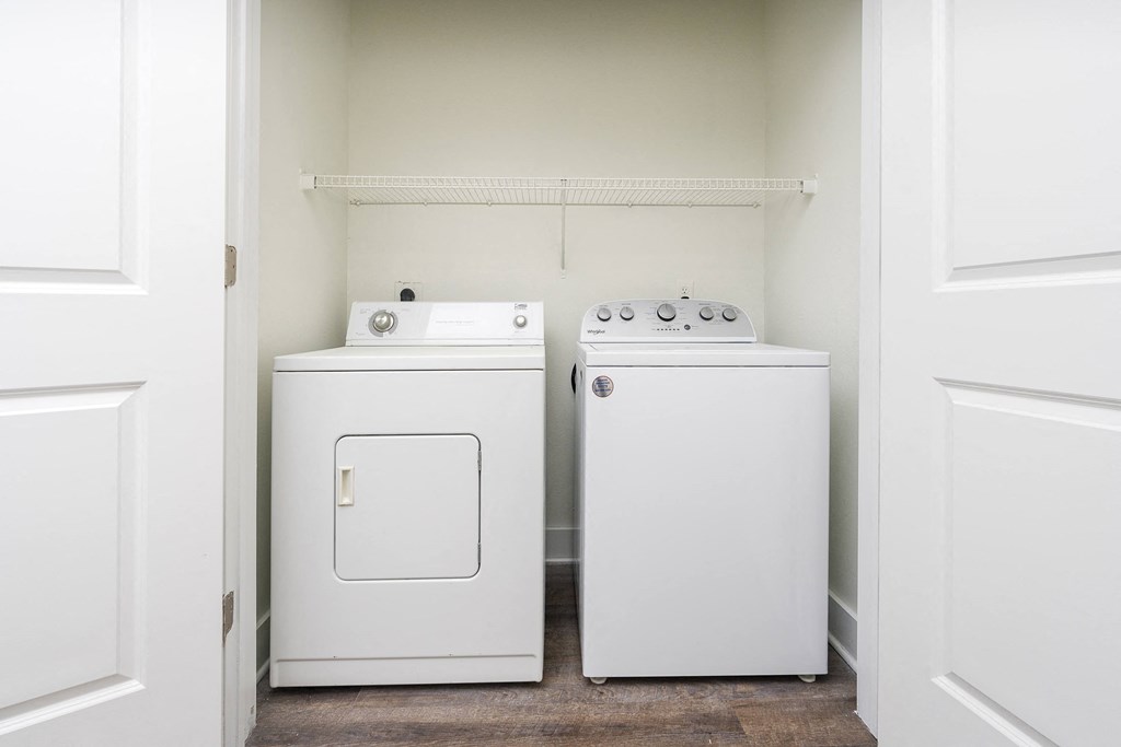 a washer and dryer in a laundry room at Trend Design District, Dallas, Texas