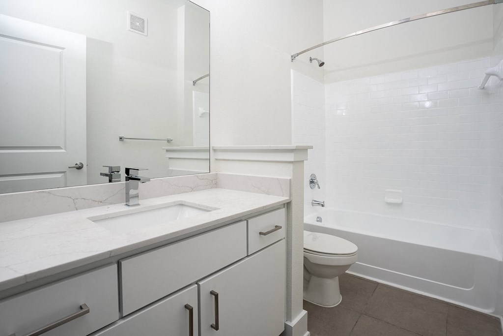a bathroom with a sink toilet and bathtub at Trend Design District, Dallas, 75207