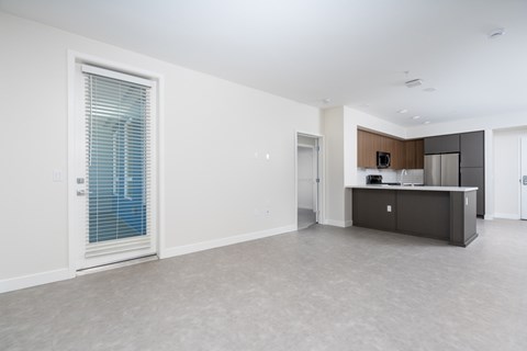 Open concept living room with modern kitchen island at Trestle Apartments, California, 91016