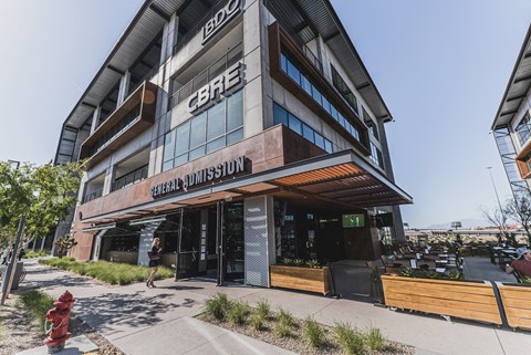 A building with the sign "CBRE" on it.