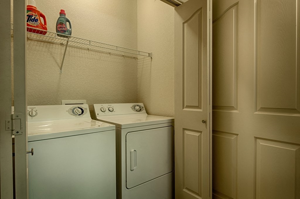 Apartments for Rent in Surprise, AZ - The Village at West Point - Laundry Room Closet with Washer and Dryer and Shelf.