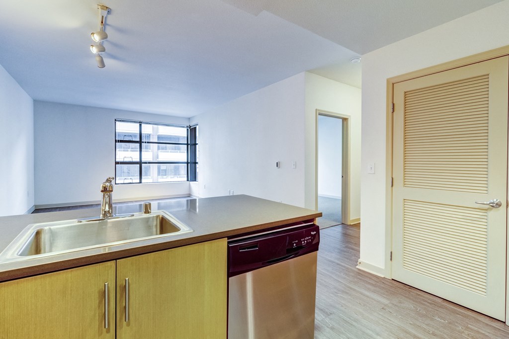 an empty kitchen with a sink and a door to a hallway at Venue, San Francisco, CA, 94158