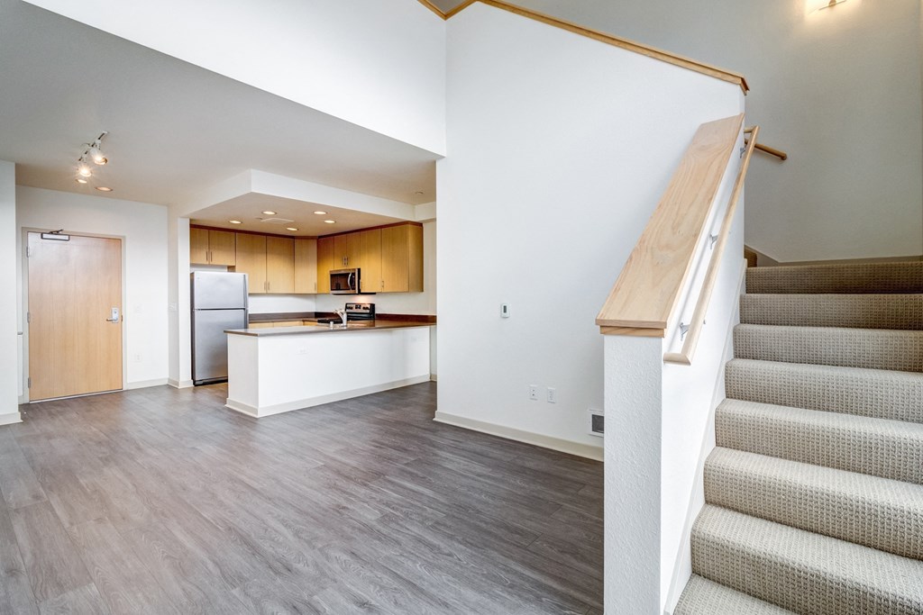 unfurnished loft style apartment with stairs and wood floor at Venue, San Francisco, CA