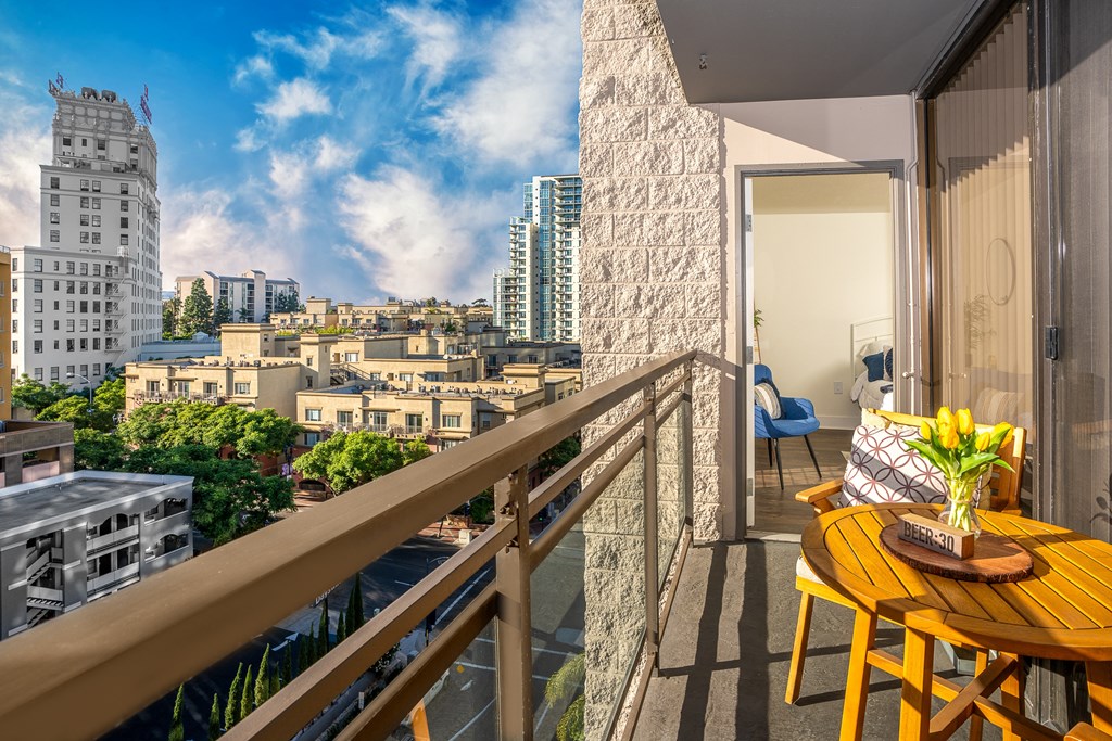 balcony with table and flowers