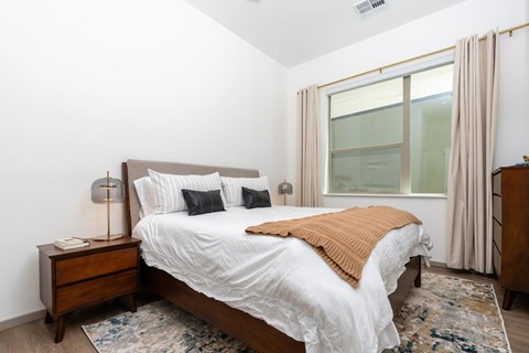 Bedroom with bed and windows