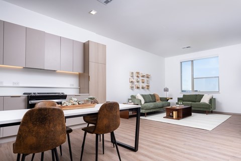 Kitchen, dining area and living room with seating