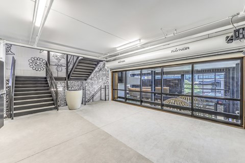 Staircase with window overlooking the clubroom