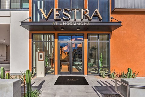 The front of a building with the name "VESTRA" on it.