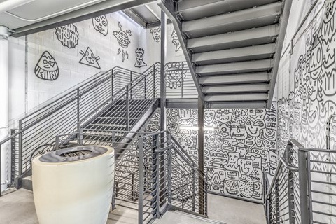 stairwell with art on the walls