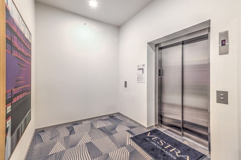 an empty hallway with an elevator door