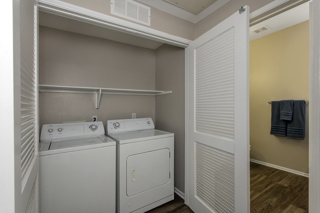 Washer and Dryer Inside Closet with Shelving at 55+ Remington at Ladera Ranch, California, 92694
