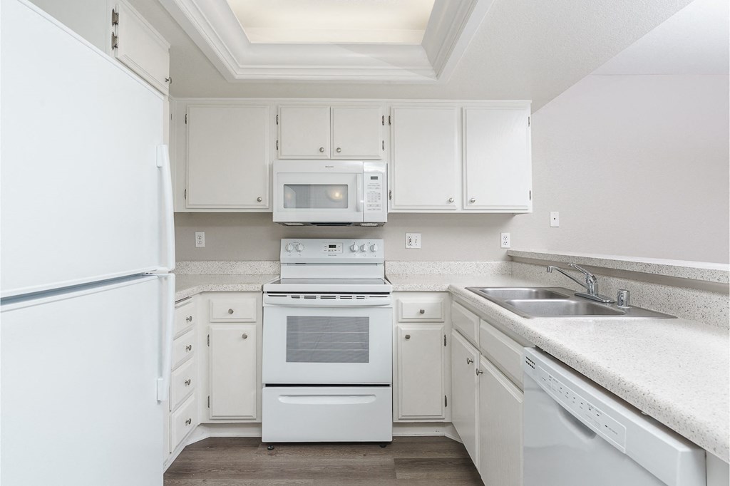 renovated kitchen with white cabinets
