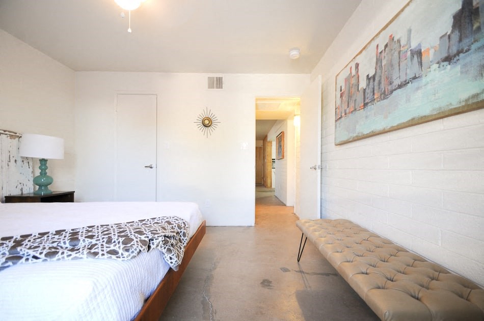 One-Bedroom Apartments in Scottsdale - Winfield Scottsdale - View of a Spacious Modern Bedroom Featuring a Minimalist Style and Large Windows