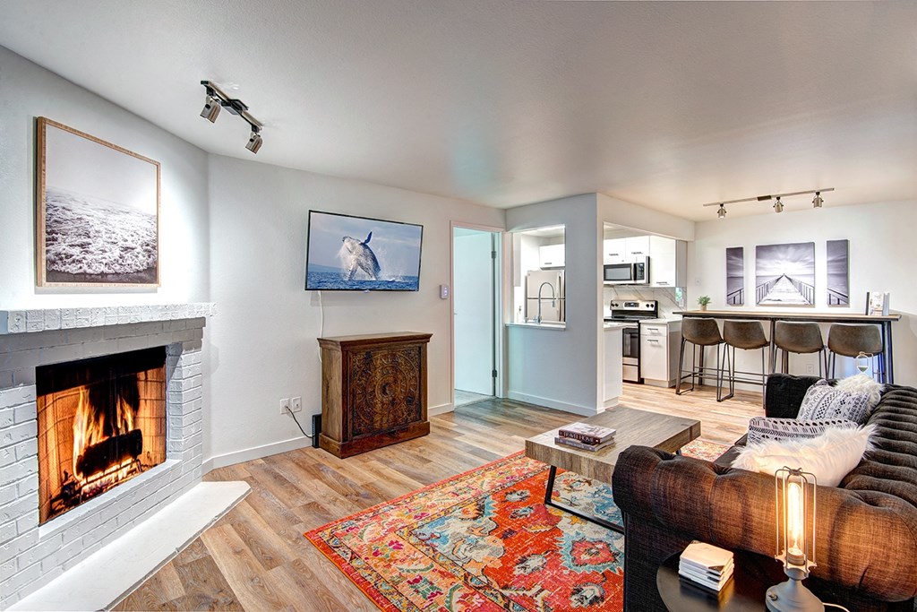 Living Room with White Walls, Fireplace at Woodlake Apartments, Washington 98034