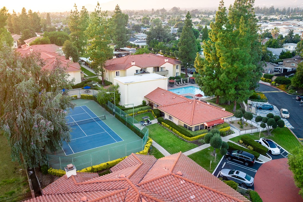 Aerial view of tennis court, parking and leasing office