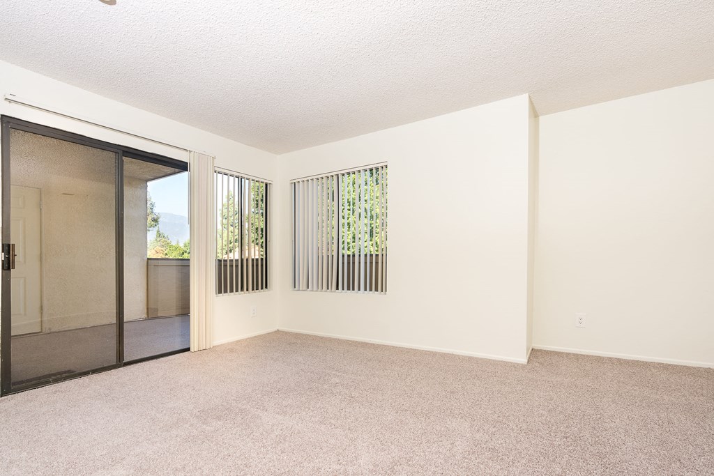 Living room with windows and balcony door