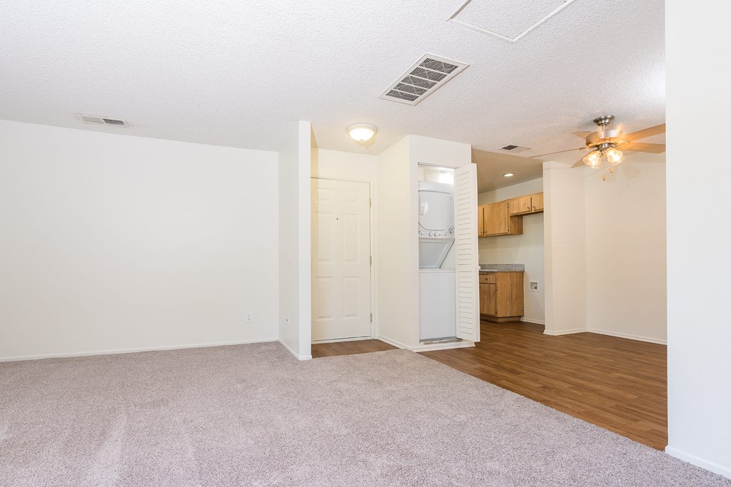 Living room, dining area with in unit washer and dryer