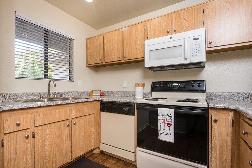 Kitchen with appliances and a window