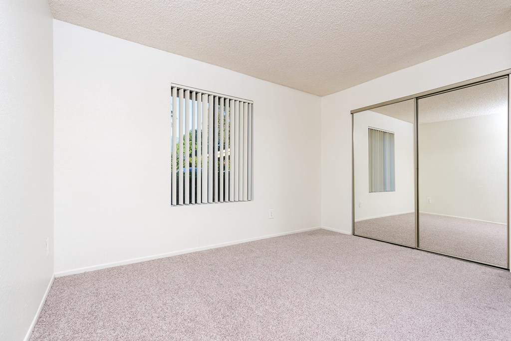 Bedroom with window and closet
