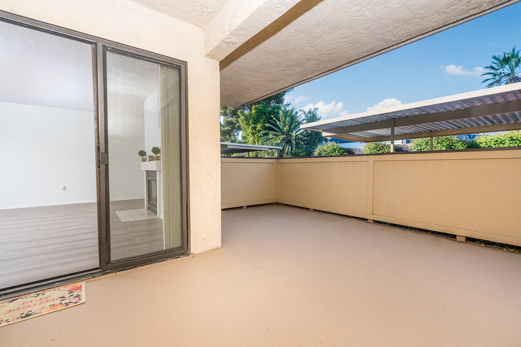 Large balcony with sliding door to unit