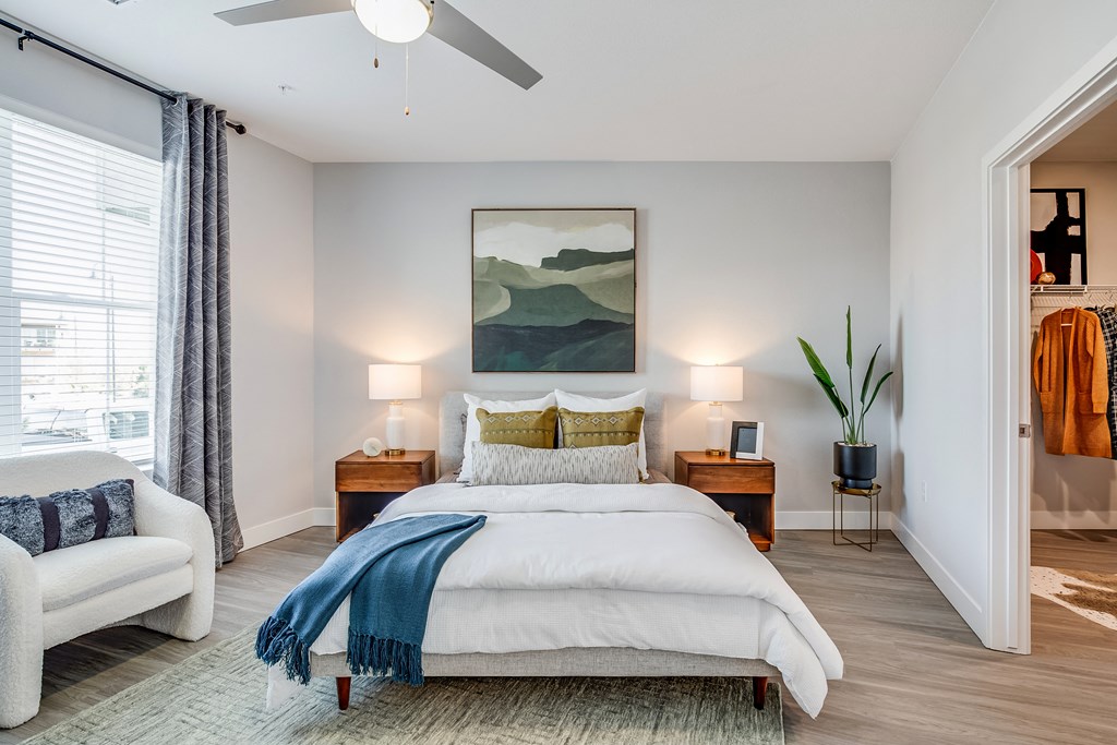 the wright model bedroom with bright open window