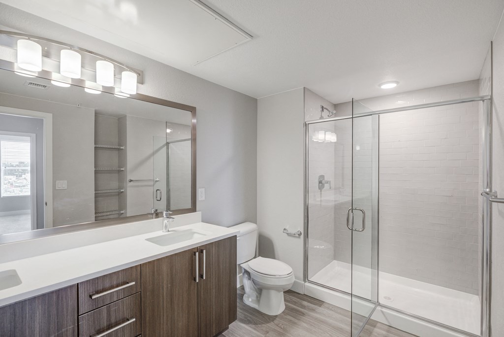 double sink bathroom with walk in shower