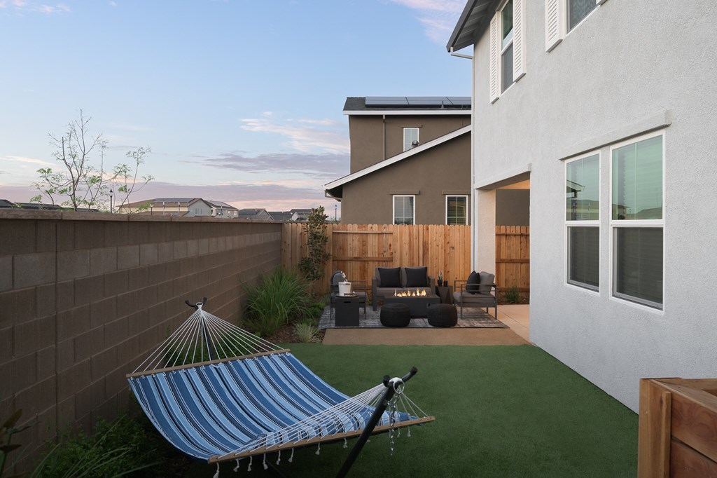 cyrene at fiddyment model backyard with hammock and grass lawn