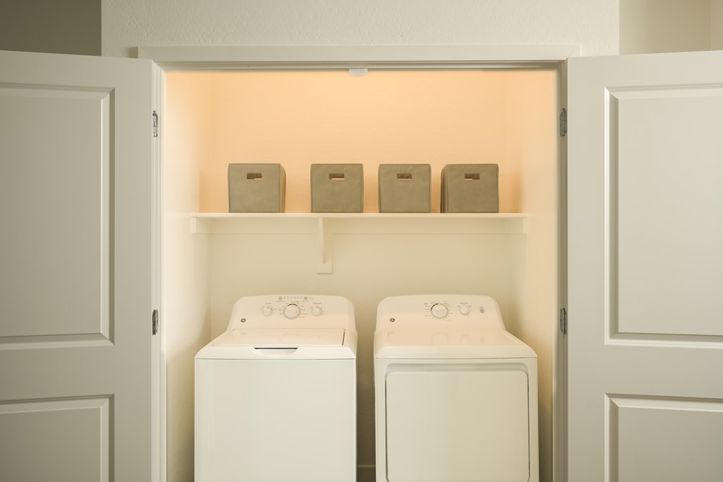 A laundry room with a washer and dryer.