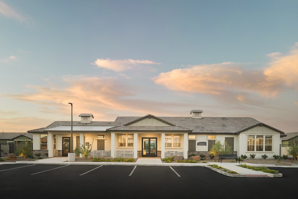 A building with a parking lot in front of it.