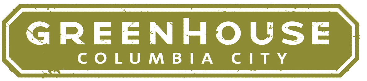A green and white sign that says Greenhouse Columbia City.