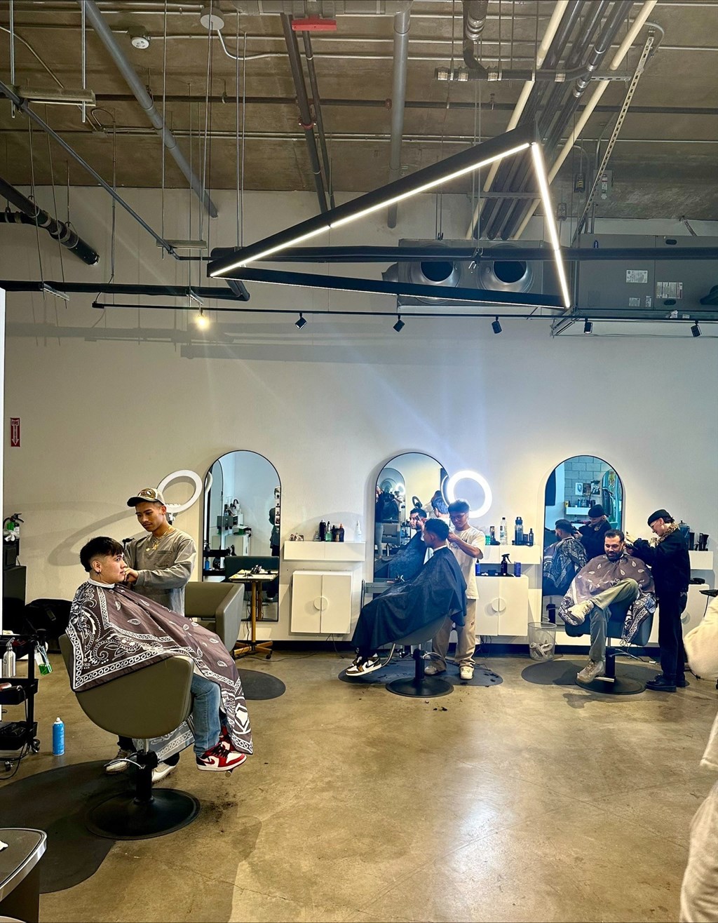 The Gray Area Salon giving haircuts to customers