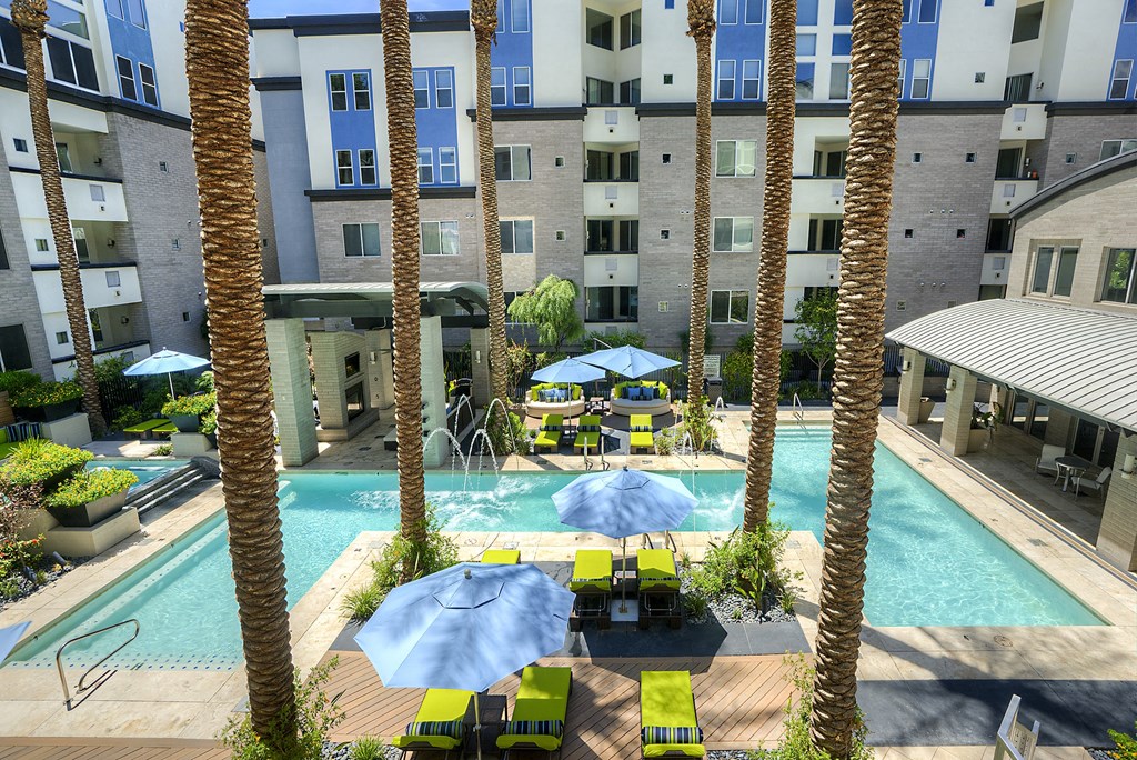 Resort style pool with palm trees