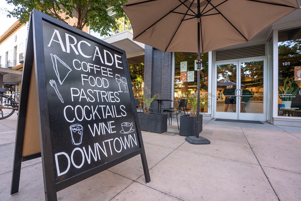 a chalkboard sign outside a coffee shop with a sign at Main+Nine, California