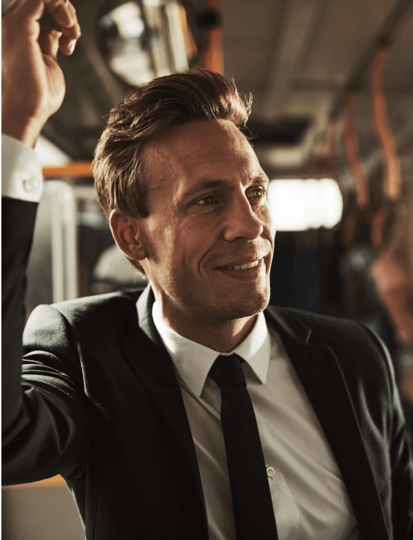 a man in a suit on a bus