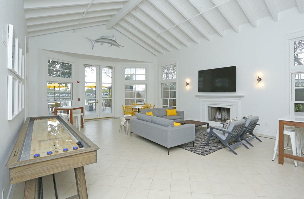 a living room with a couch and a table and a fireplace
