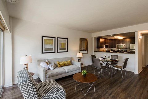 A living room with a grey couch and a coffee table.