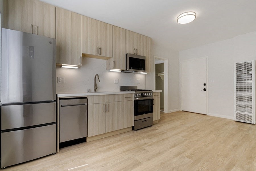 a kitchen and living room in a 555 waverly unit