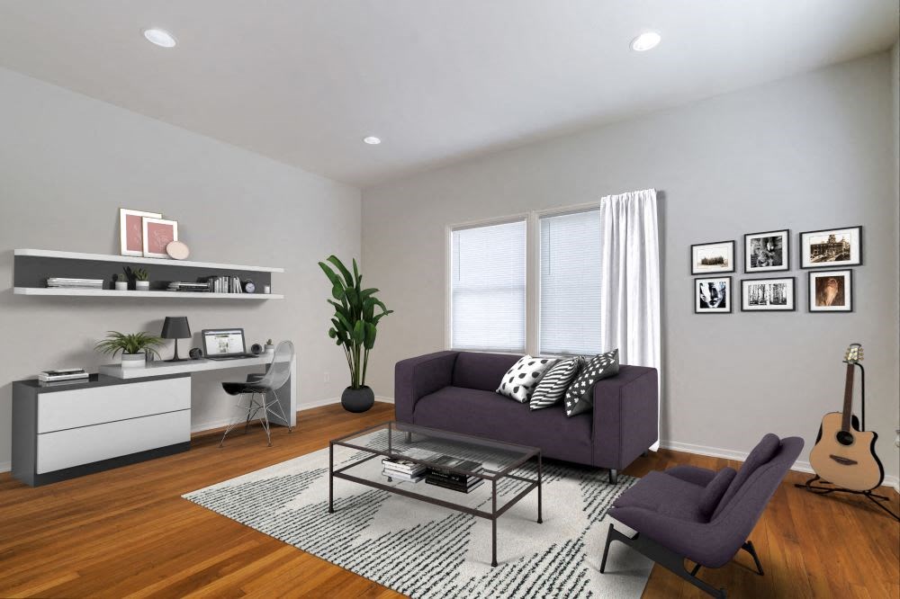 a living room with couch and chair