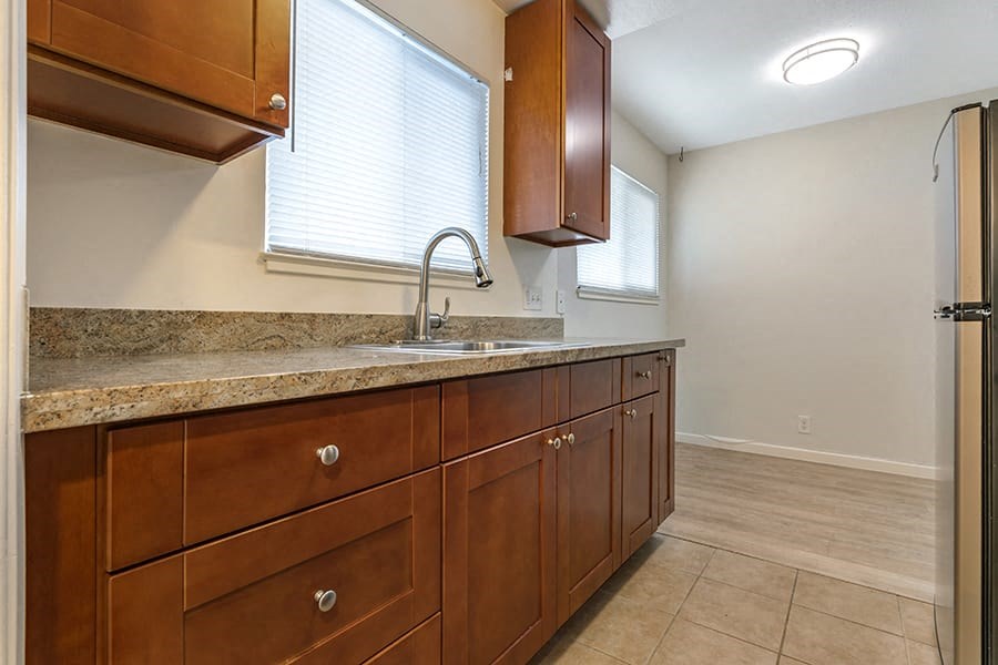 a kitchen with a sink and cabinets