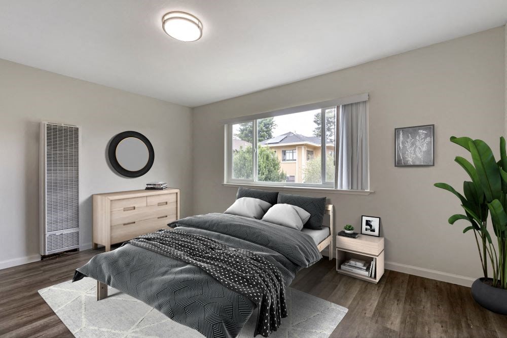 a bedroom with a bed and a large window