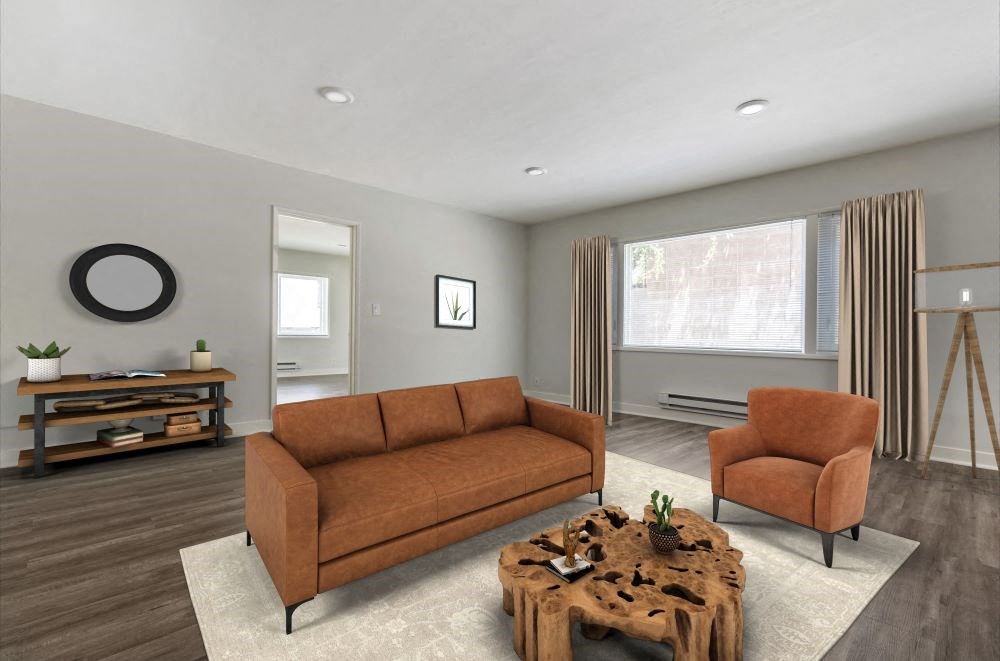 a living room with gray walls and a brown couch