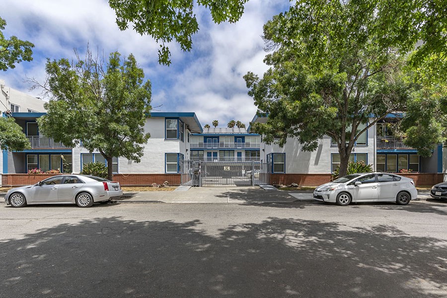a large building with a parking lot in front of it