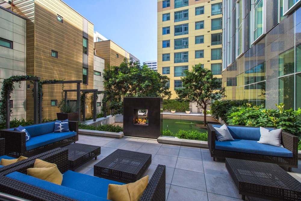 Ground floor outdoor courtyard w/ fireplace & putting green