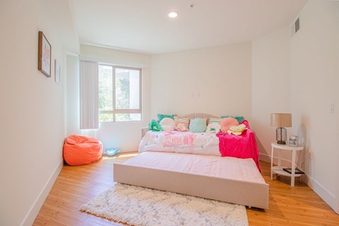 A bedroom with a large bed and a pink blanket at Woodley Sara Apartment, Van Nuys, CA, 91406